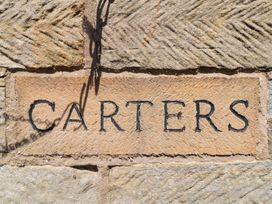 A stone wall with the name CARTERS in Staintondale near Burniston