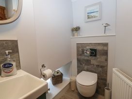 A bathroom with a sink and toilet at Rose Cottage Broughton-In-Furness