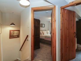A hallway leading to a bedroom in Rose Cottage, Broughton-In-Furness
