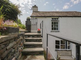 Steps leading to a gated entrance at Rose Cottage in Broughton-In-Furness