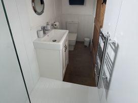 A bathroom with a sink and toilet at Shepherds Cabin at Titterstone Clee Hill