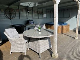 An outdoor space with a table and chairs at Shepherds Cabin at Titterstone Clee Hill