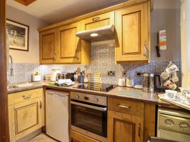 A kitchen with appliances and utensils at Gelli Glud in Eglwysbach
