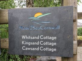 A sign for Moor2SeaCornwall displaying cottage names in Tideford