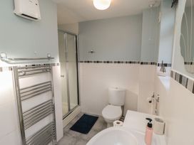 A bathroom with a shower and sink at Bramla in Staithes