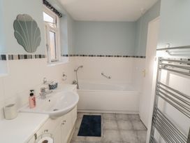A bathroom with a sink and bathtub at Bramla in Staithes
