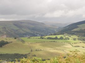 A landscape view of hills and fields at Caner Bach Lodge in Blackmill