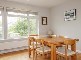 A dining room with a table and chairs at The Meadow in Feock near Carnon Downs