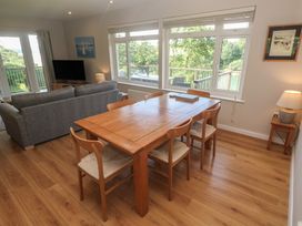 A dining room with a table and chairs at The Meadow in Feock near Carnon Downs