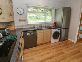 A kitchen with appliances and cabinets at The Meadow in Feock near Carnon Downs