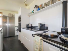 A kitchen featuring appliances and a countertop at Pentreath in Crantock