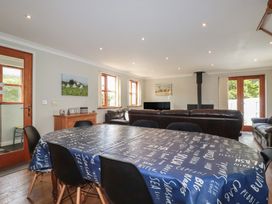 A dining room with a table and chairs at Carpe Diem in Crantock