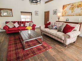 A living room with two sofas and a coffee table at The Turnip Barn in 