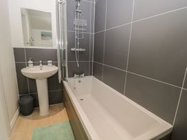 A bathroom with a shower and sink at The Turnip Barn in 