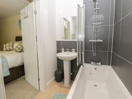 A bathroom with a bathtub and sink at The Turnip Barn in 