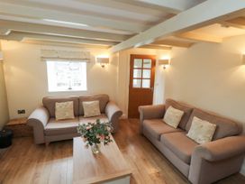 A living room with two sofas and a coffee table at Tan Y Goeden in Morfa Nefyn