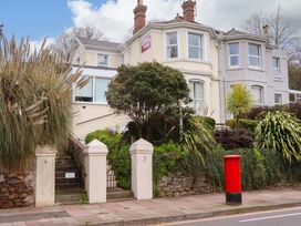 An outdoor view of a building with a post box at Avenue Park Villa in Torquay