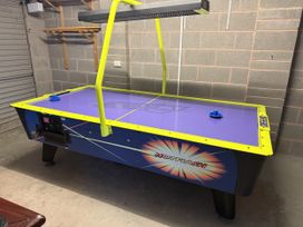 An air hockey table in a game room at Westpoint Llandudno