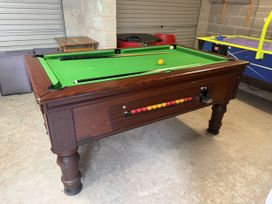 A pool table with balls and a cue in a game room at Westpoint Llandudno