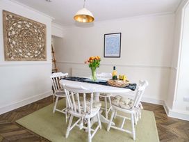 A dining room with a table and chairs at Springfield in Hempton near Fakenham