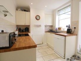 A kitchen with a toaster, kettle, and dishwasher at Springfield in Hempton near Fakenham