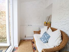 A snug with a sofa and radiator at Springfield in Hempton near Fakenham