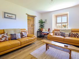 A living room with sofas and a coffee table at Cefn Nannau near Ty-nant near Cerrigydrudion