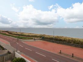 A view of the sea and sky from a road near the beach at Welymora Pwllheli