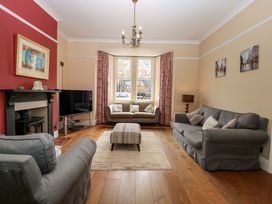 A living room with a sofa and coffee table at Tilly's Retreat in Hunstanton