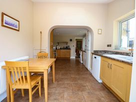 A kitchen with a table and chairs at Tilly's Retreat in Hunstanton