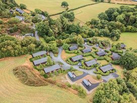 An aerial view of cabins and greenery at Glanyrafon Bungalow St Harmon