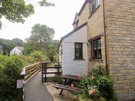 A house with a garden and pathway at Tranquility in Falmouth
