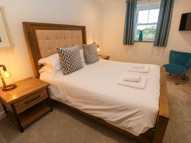 A bedroom with a bed and bedside table at Silvermine House in Charlestown