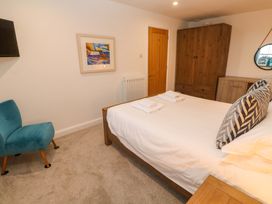 A bedroom with a bed and furniture at Silvermine House in Charlestown