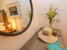 A bedroom with a bed and nightstand at Silvermine House Charlestown