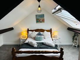 A bedroom with a bed and skylight at Trearddur View Treaddur Bay