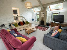 A living room with sofas and a coffee table at The Coach House in Llangollen