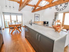 A dining room with a table and chairs at Apple Tree Cottage near Kirkby Stephen