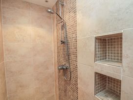 A shower with tiles and niches at Apartment 6 in Whitby