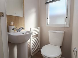 A bathroom with a sink and toilet at K2 Static Caravan