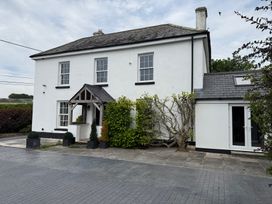 A house with a pathway and plants at Penlaurel in Launceston