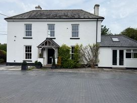 A house with a front porch and garden at Penlaurel Launceston