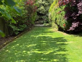 A garden pathway surrounded by bushes at Penlaurel in Launceston