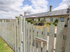An outdoor view of a cottage with a garden at Mappowder Cottage Buckland Newton near Dorchester
