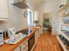 A kitchen with countertop and appliances at Mappowder Cottage in Buckland Newton near Dorchester