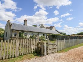 A house with a fence and garden at Maple Cottage Buckland Newton near Dorchester