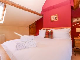 A bedroom with a bed and decor at Elm View in Chipping Campden