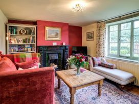 A living room with a sofa and a coffee table at Elm View Chipping Campden