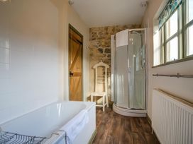 A bathroom featuring a bathtub and shower at Elm View in Chipping Campden