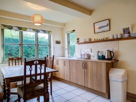 A kitchen with a table and chairs at Elm View in Chipping Campden